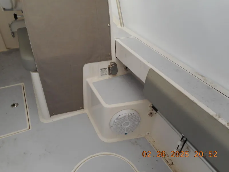 Slide: The Image of 2024 NorthCoast 255HT boat interior with seating and speaker system. - 35