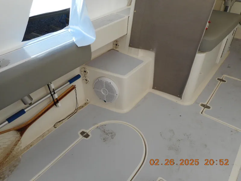 Slide: The Image of 2024 NorthCoast 255HT boat interior with seating and storage compartments. - 36