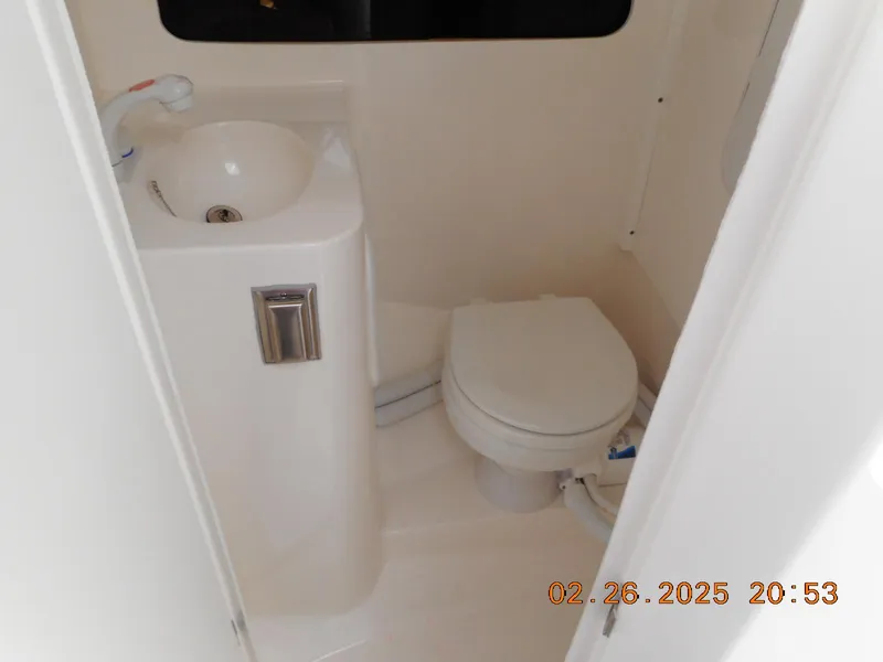 Slide: The Image of 2024 NorthCoast 255HT boat bathroom with sink and toilet. - 38