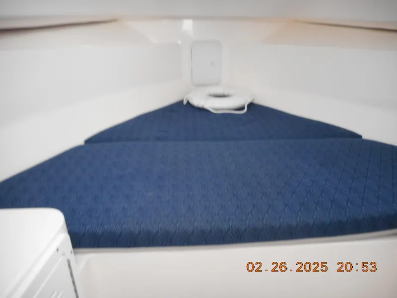 Slide: The Image of 2024 NorthCoast 255HT cabin interior with blue cushioned seating. - 39