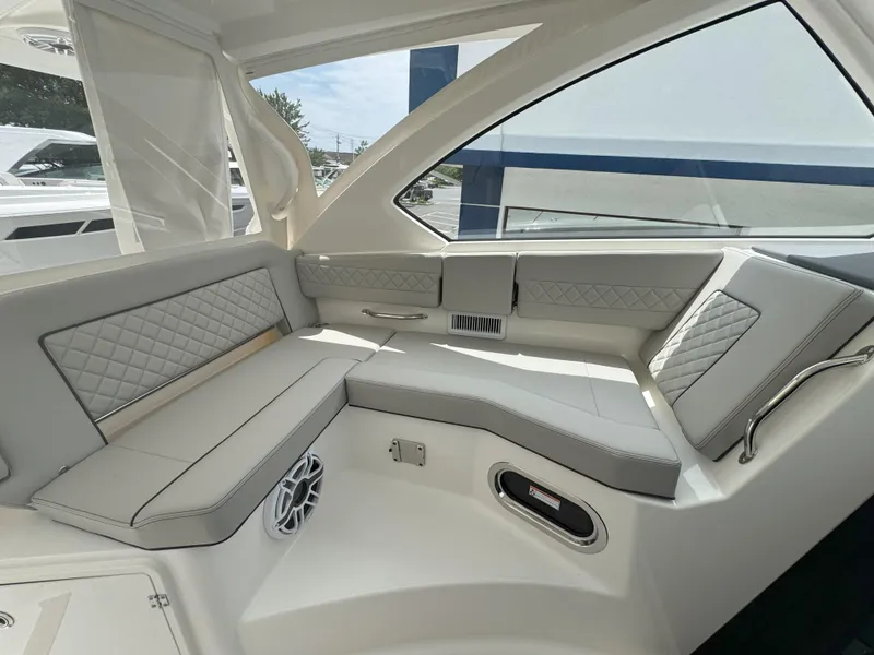 Slide: The Image of Luxurious interior seating of 2025 Pursuit OS 355 Offshore boat, featuring elegant design and comfort. - 16