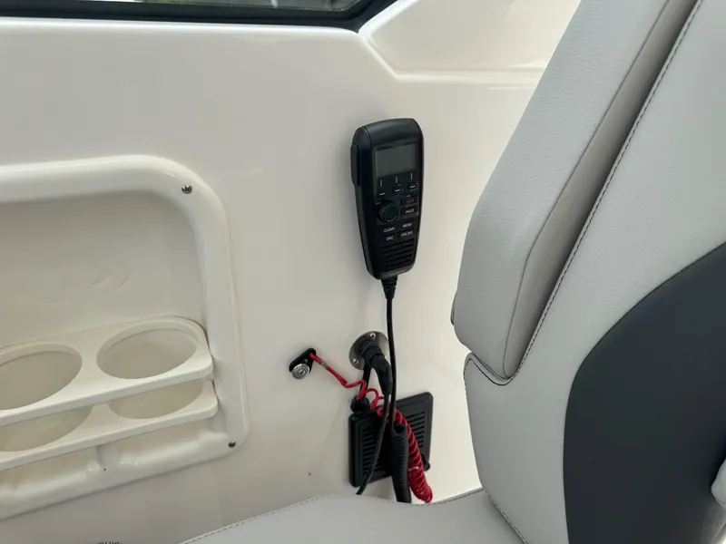 Slide: The Image of Interior of 2025 Pursuit OS 355 Offshore boat with radio and cup holders. - 23