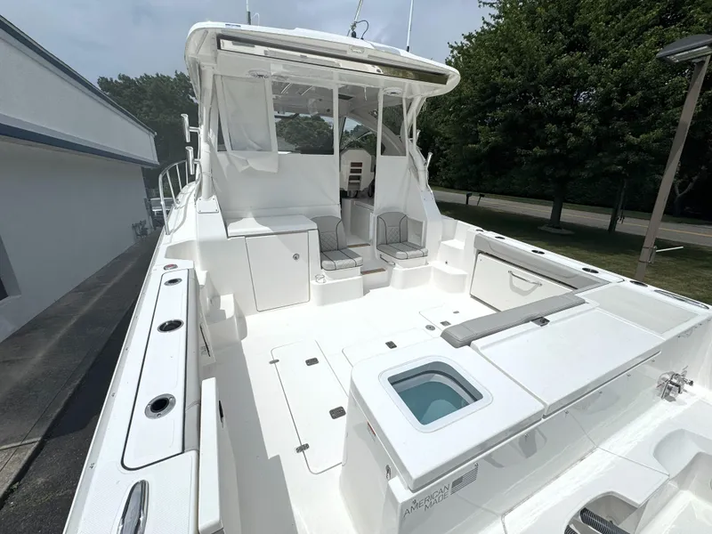 Slide: The Image of 2025 Pursuit OS 355 Offshore boat with spacious deck and seating area. - 6