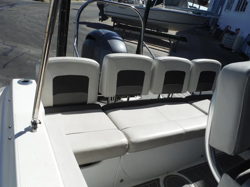 Slide: The Image of 2019 Hurricane Center Console 21 OB boat interior with cushioned seating. - 10
