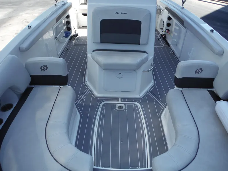 Slide: The Image of 2019 Hurricane Center Console 21 OB boat interior with cushioned seating and sleek design. - 14