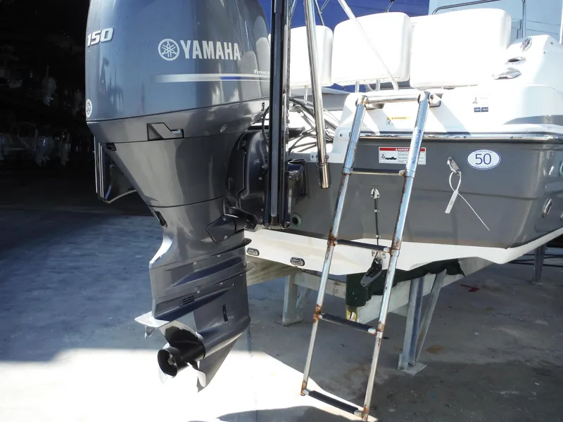 Slide: The Image of 2019 Hurricane Center Console 21 OB with Yamaha outboard motor and ladder. - 20