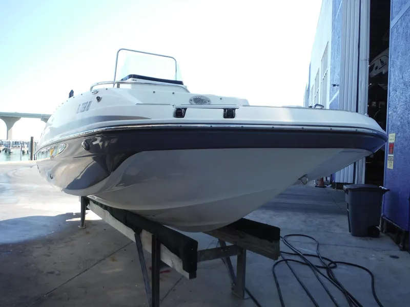 Slide: The Image of 2019 Hurricane Center Console 21 OB boat on a trailer, dockside view. - 5