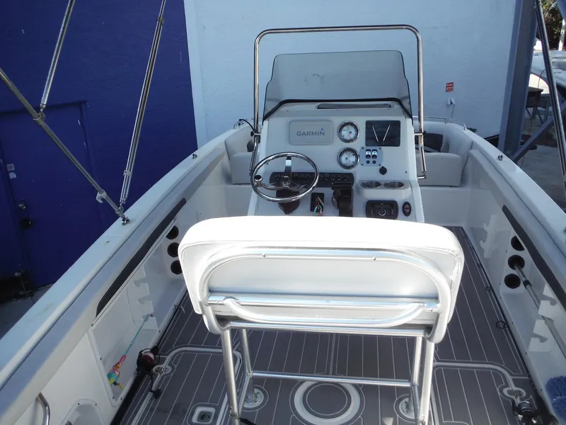 Slide: The Image of 2019 Hurricane Center Console 21 OB boat interior with steering wheel and dashboard. - 8