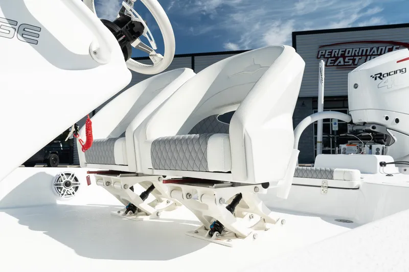 Slide: The Image of Turner Boatworks 2025 24 SAVAGE boat seats, white and gray, with modern design. - 12
