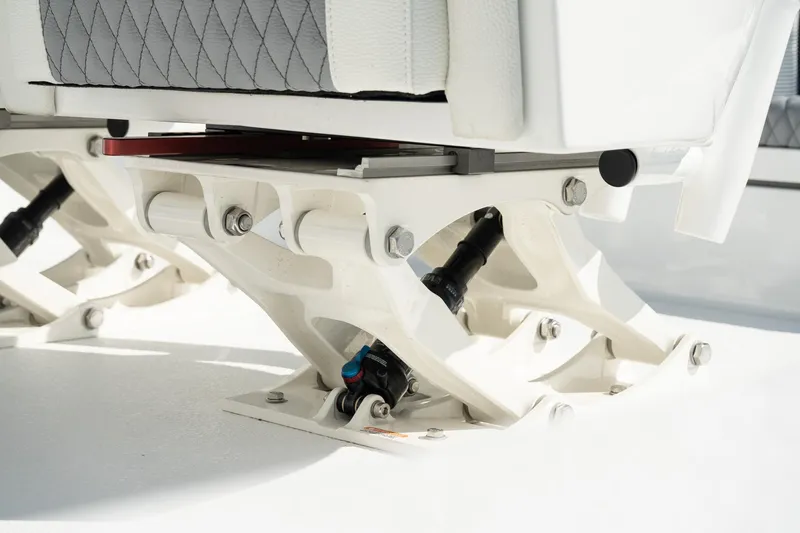 Slide: The Image of Turner Boatworks 2025 24 SAVAGE seat base detail with white and gray design. - 13