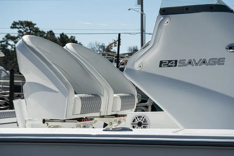 Slide: The Image of 2025 Turner Boatworks 24 SAVAGE, featuring sleek seating and modern design. - 15