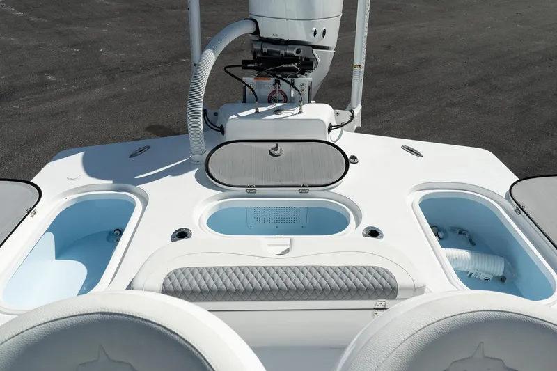 Slide: The Image of 2025 Turner Boatworks 24 SAVAGE deck with storage compartments and seating. - 17