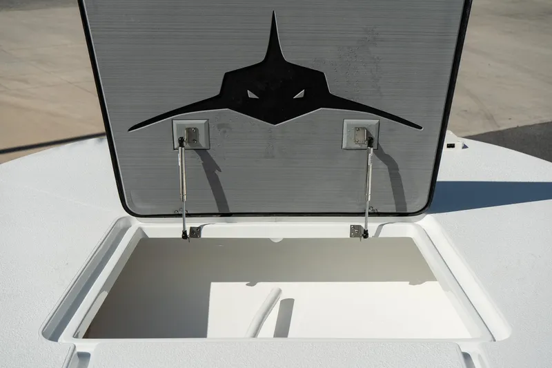 Slide: The Image of Open storage compartment on 2025 Turner Boatworks 24 SAVAGE with shark logo. - 22