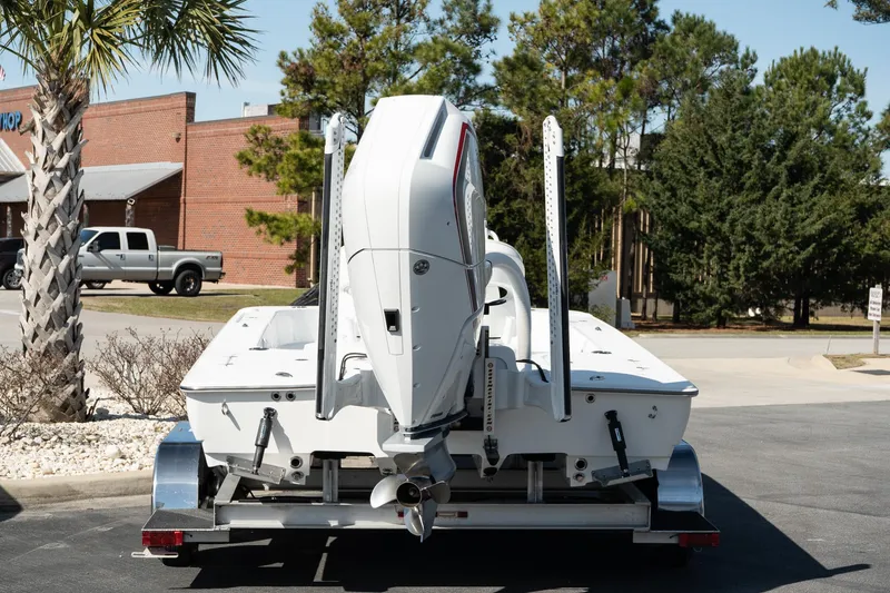 Slide: The Image of 2025 Turner Boatworks 24 SAVAGE on trailer, rear view, outdoors. - 6