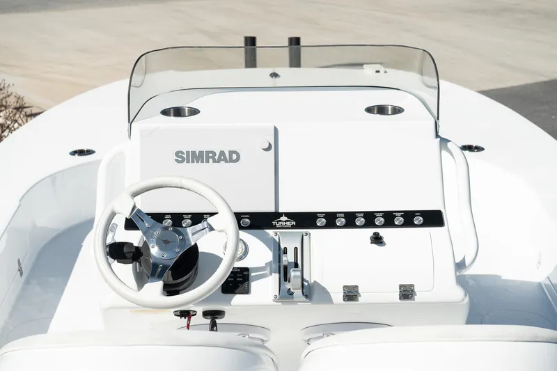 Slide: The Image of Turner Boatworks 2025 24 SAVAGE console with Simrad electronics and steering wheel. - 9