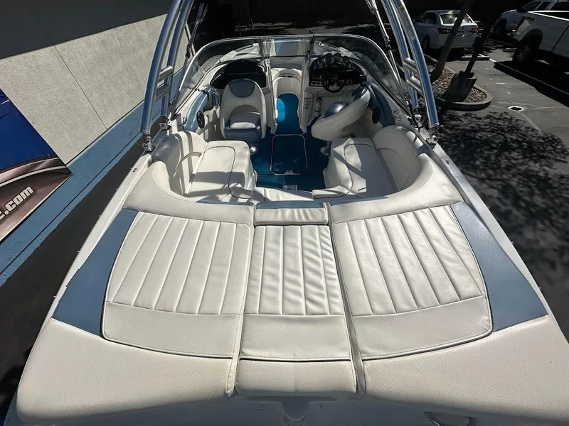 Slide: The Image of 2012 Bayliner 235 Bowrider with white leather interior, parked outdoors. - 11