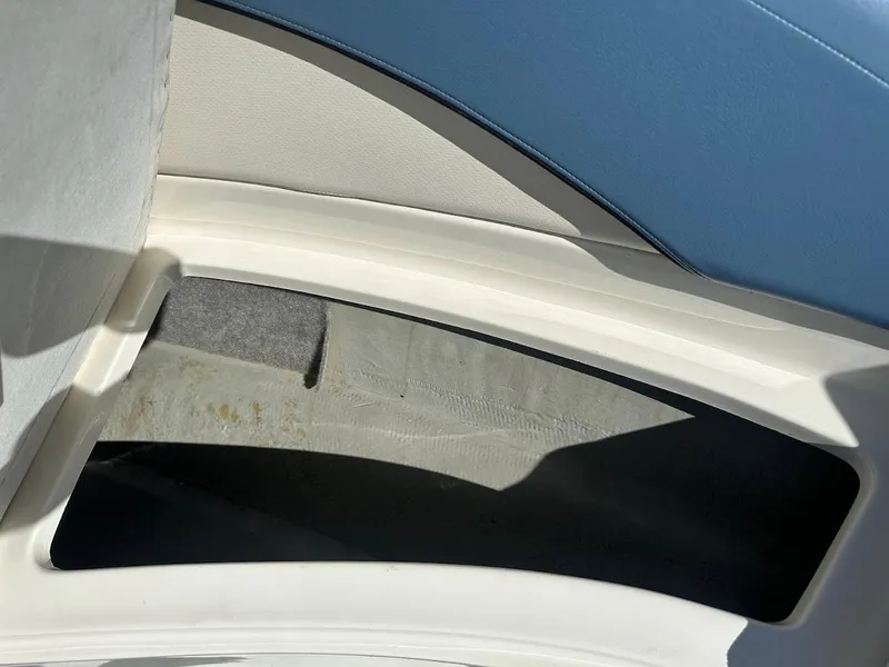 Slide: The Image of Interior detail of 2012 Bayliner 235 Bowrider boat, featuring storage compartment. - 34
