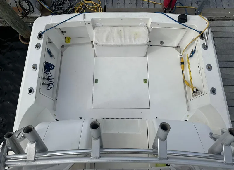 Slide: The Image of 1998 Phoenix 32 Tournament boat deck with fishing rod holders and storage compartments. - 8