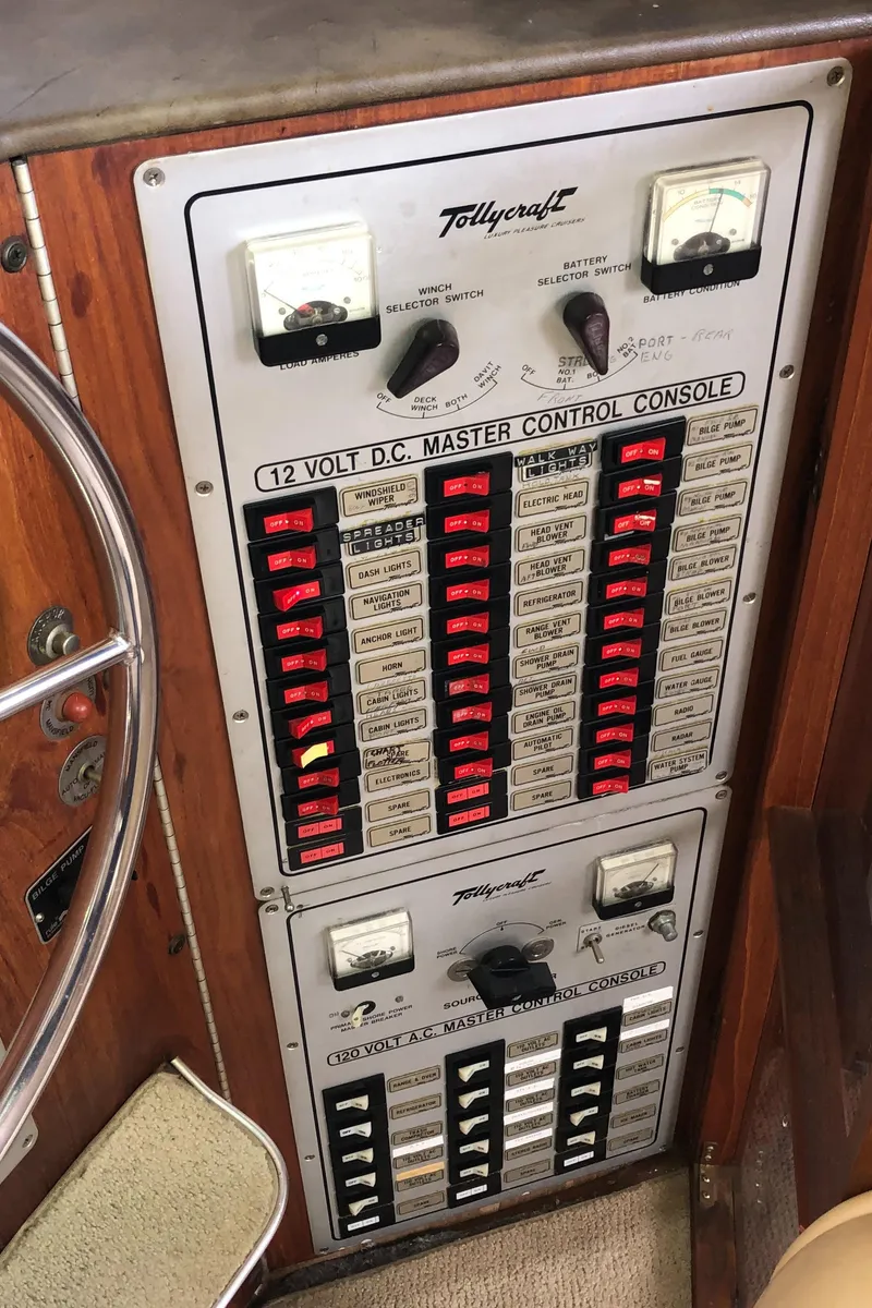 Slide: The Image of Control panel of 1976 Tollycraft 48 Cockpit Motor Yacht with switches and gauges. - 19