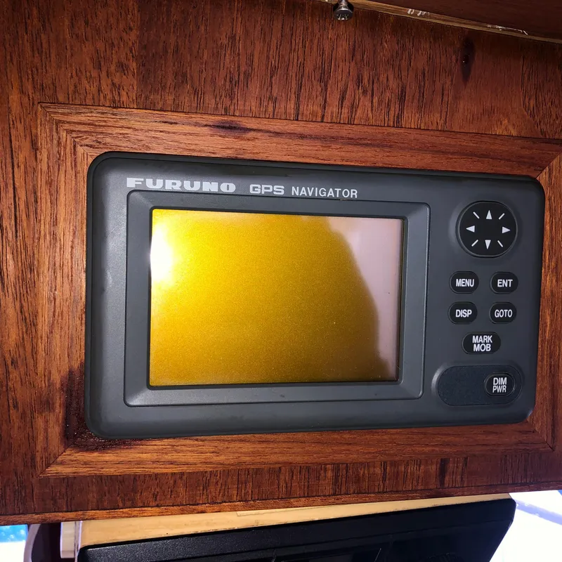 Slide: The Image of Furuno GPS navigator on 1976 Tollycraft 48 Cockpit Motor Yacht, mounted on wooden panel. - 20