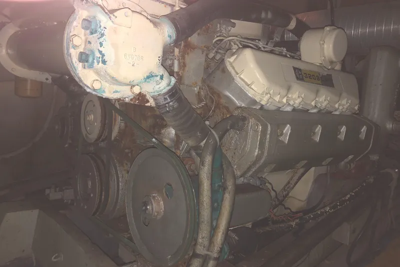 Slide: The Image of Engine of 1976 Tollycraft 48 Cockpit Motor Yacht in dimly lit setting. - 31