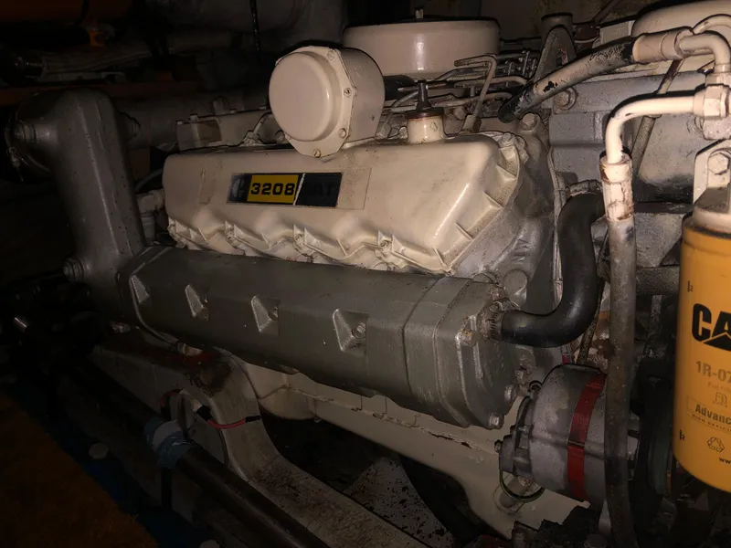 Slide: The Image of Engine of a 1976 Tollycraft 48 Cockpit Motor Yacht, featuring a CAT 3208 diesel engine. - 32