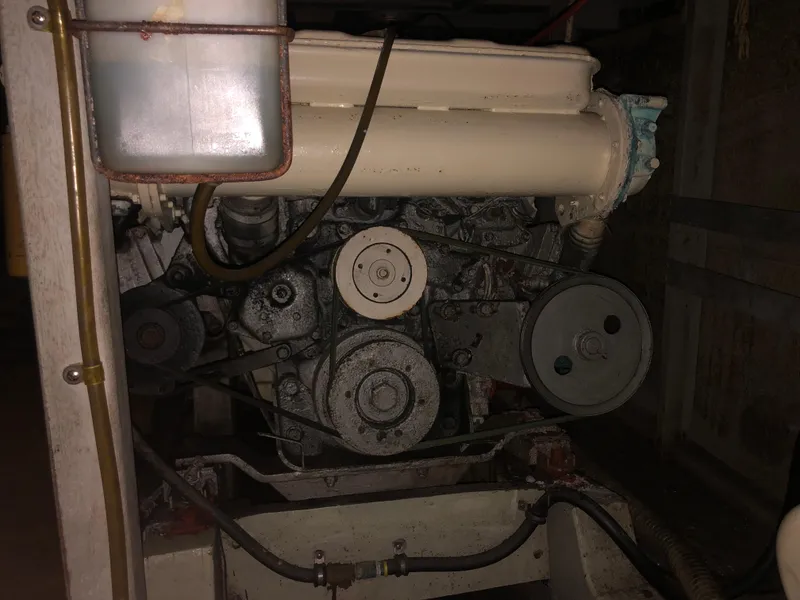 Slide: The Image of Engine of 1976 Tollycraft 48 Cockpit Motor Yacht, showcasing mechanical components. - 33