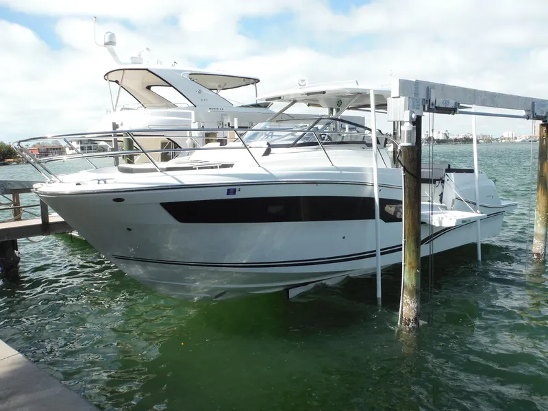 Slide: The Image of 2023 Jeanneau Leader 10.5 WA Series 2 boat docked on water. - 2