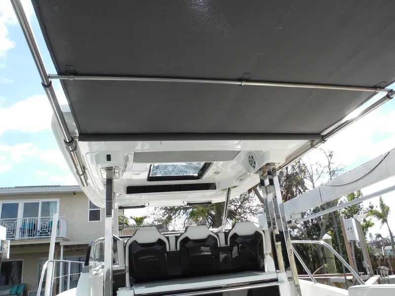 Slide: The Image of 2023 Jeanneau Leader 10.5 WA Series 2 boat interior with seating and canopy. - 22