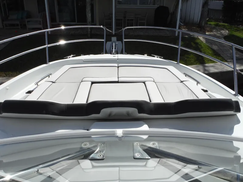 Slide: The Image of 2023 Jeanneau Leader 10.5 WA Series 2 boat with cushioned deck seating. - 25