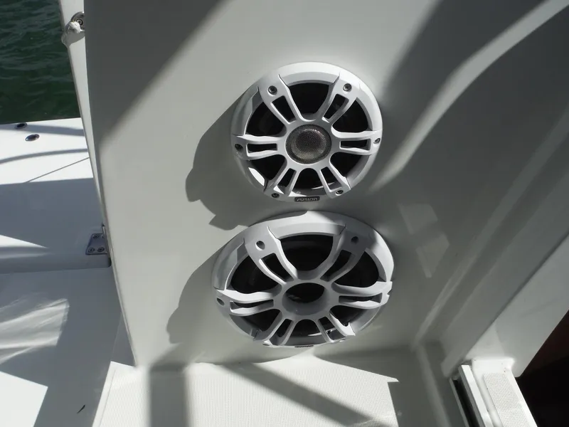 Slide: The Image of 2023 Jeanneau Leader 10.5 WA Series 2 boat speakers, white exterior, close-up view. - 27
