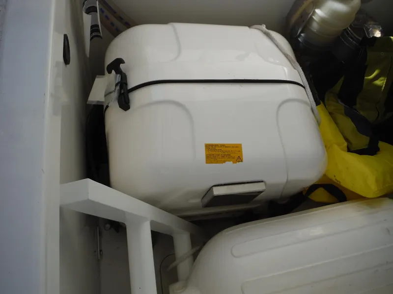 Slide: The Image of 2023 Jeanneau Leader 10.5 WA Series 2 boat storage compartment with safety equipment. - 44