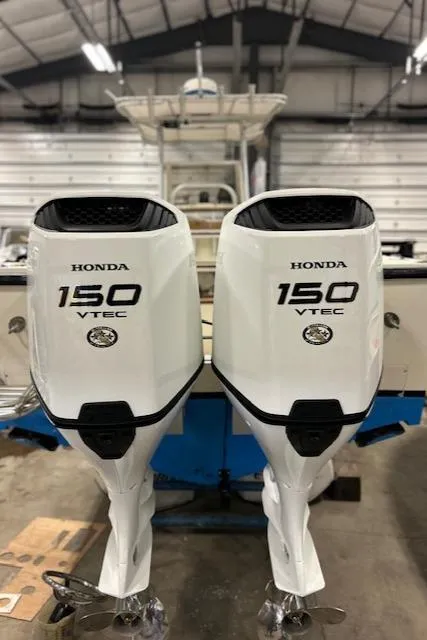 Slide: The Image of Twin Honda 150 VTEC outboard engines on a 1990 Mako 261 Center Console boat. - 9