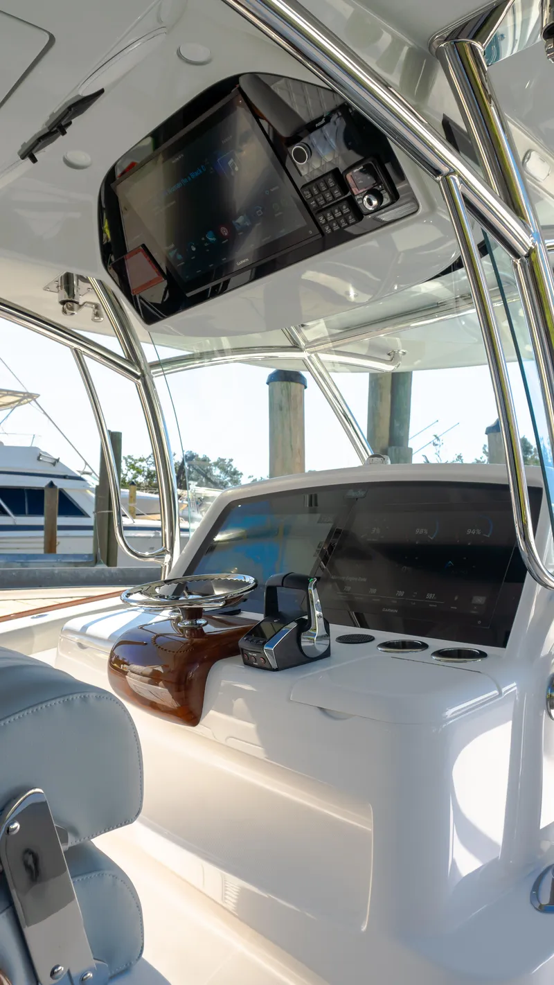 Slide: The Image of 2026 Mag Bay 43 CC yacht interior with modern navigation equipment and sleek design. - 15