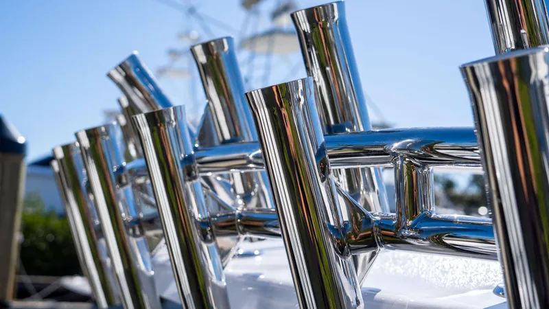 Slide: The Image of Close-up of chrome rod holders on 2026 Mag Bay 43 CC boat. - 19