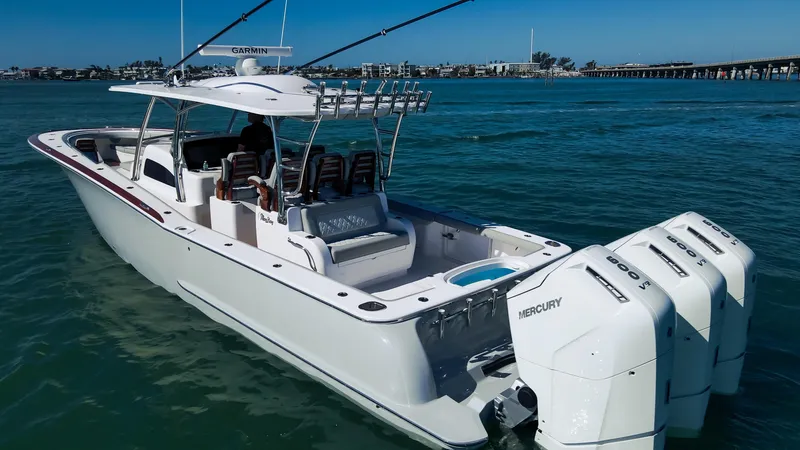 Slide: The Image of 2026 Mag Bay 43 CC boat with triple Mercury engines on the water. - 4