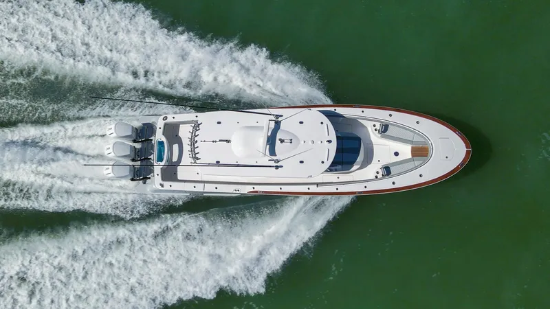 Slide: The Image of Aerial view of 2026 Mag Bay 43 CC boat cruising on water. - 5