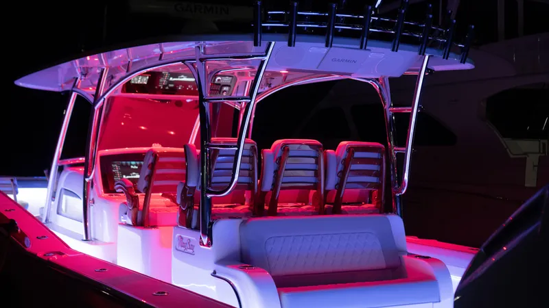 Slide: The Image of 2026 Mag Bay 43 CC boat interior with vibrant red lighting. - 6