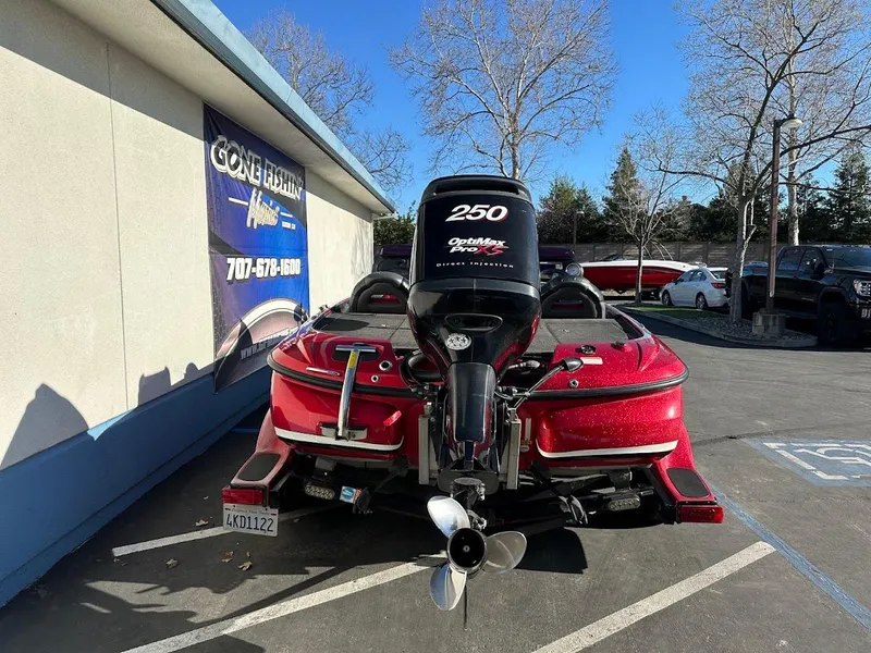 Slide: The Image of 2008 Nitro Z9 boat with 250 horsepower engine parked outdoors. - 10