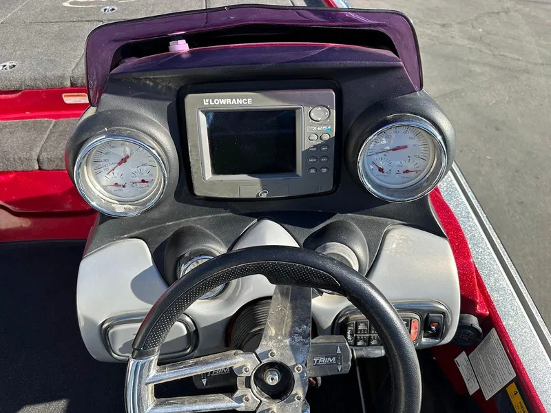 Slide: The Image of Steering console of 2008 Nitro Z9 boat with gauges and Lowrance display. - 17
