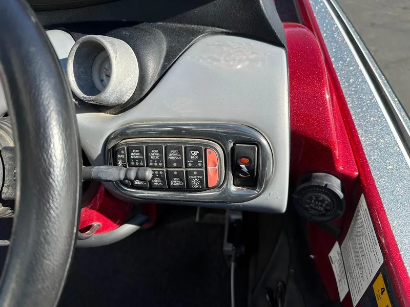 Slide: The Image of Control panel of a 2008 Nitro Z9 boat with steering wheel and switches. - 19
