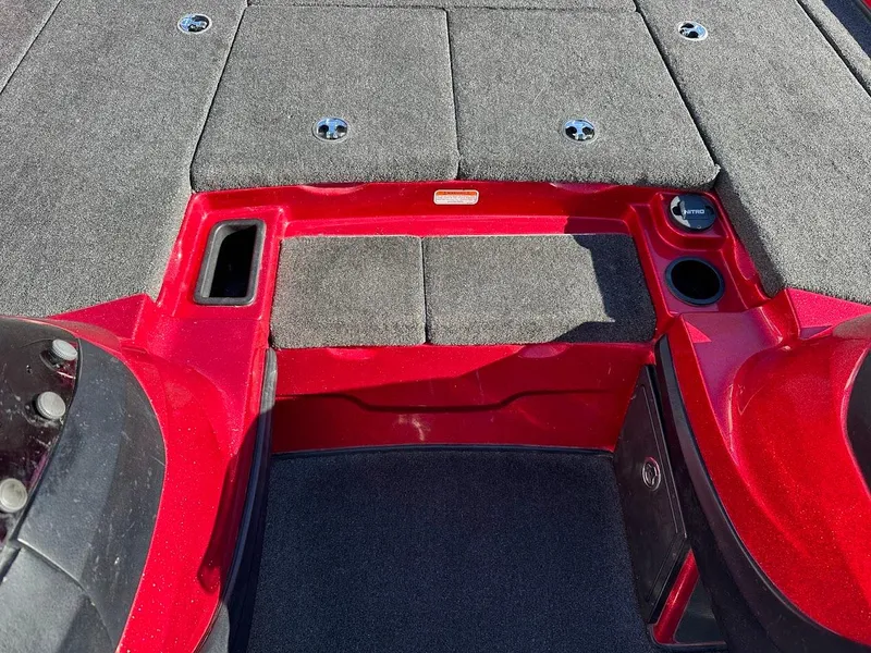 Slide: The Image of 2008 Nitro Z9 boat interior with red accents and carpeted flooring. - 26
