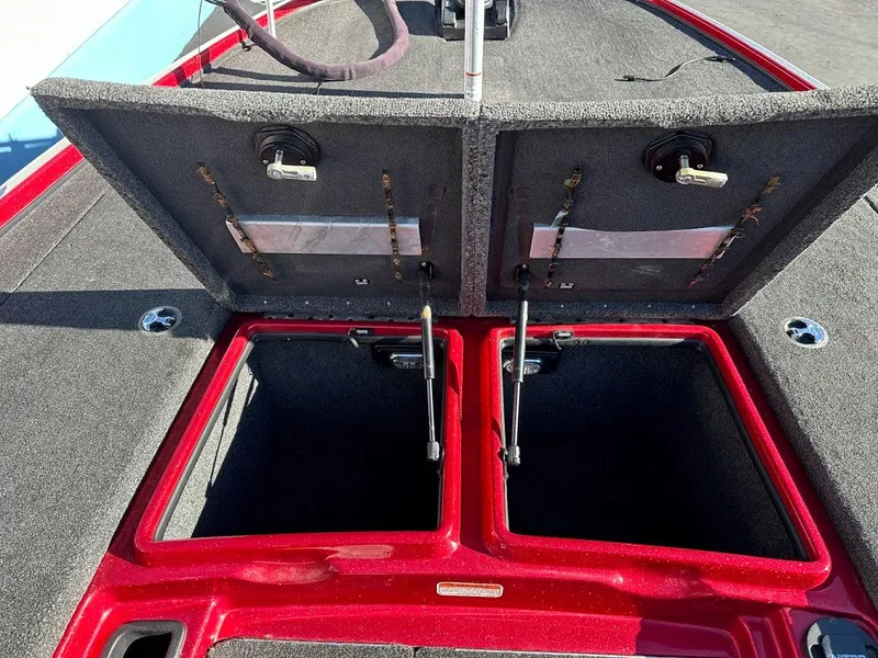 Slide: The Image of 2008 Nitro Z9 boat storage compartments open, showcasing spacious interior. - 30