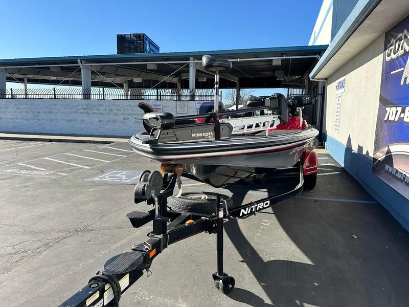 Slide: The Image of 2008 Nitro Z9 boat on trailer in parking lot, sunny day. - 4