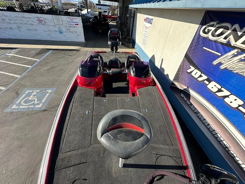 Slide: The Image of 2008 Nitro Z9 boat with red accents parked near a dealership. - 43