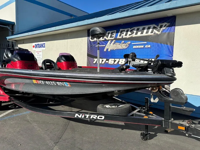 Slide: The Image of 2008 Nitro Z9 fishing boat on trailer, parked outside a building. - 5