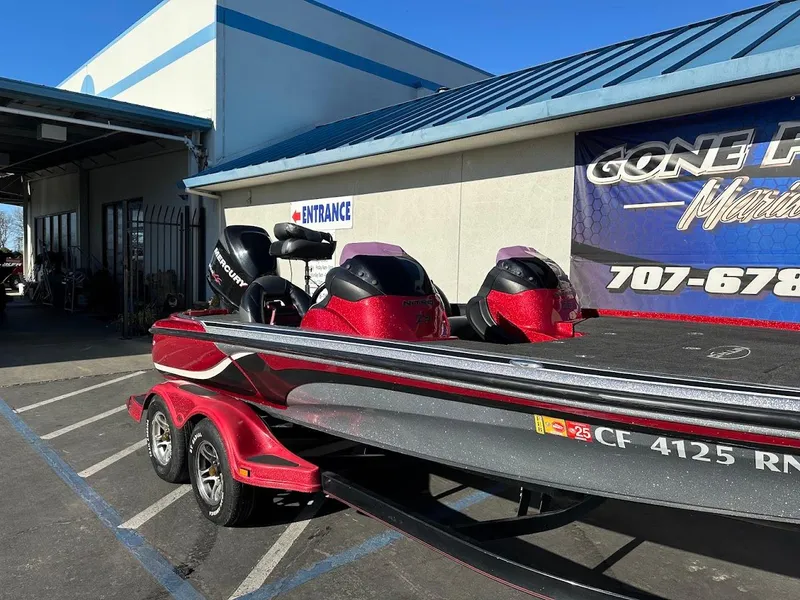 Slide: The Image of 2008 Nitro Z9 boat with dual motors on a trailer outside a marine shop. - 6