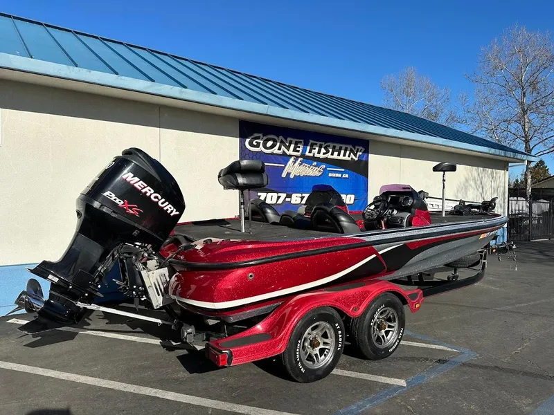 Slide: The Image of Red 2008 Nitro Z9 boat with Mercury engine parked outside dealership. - 8