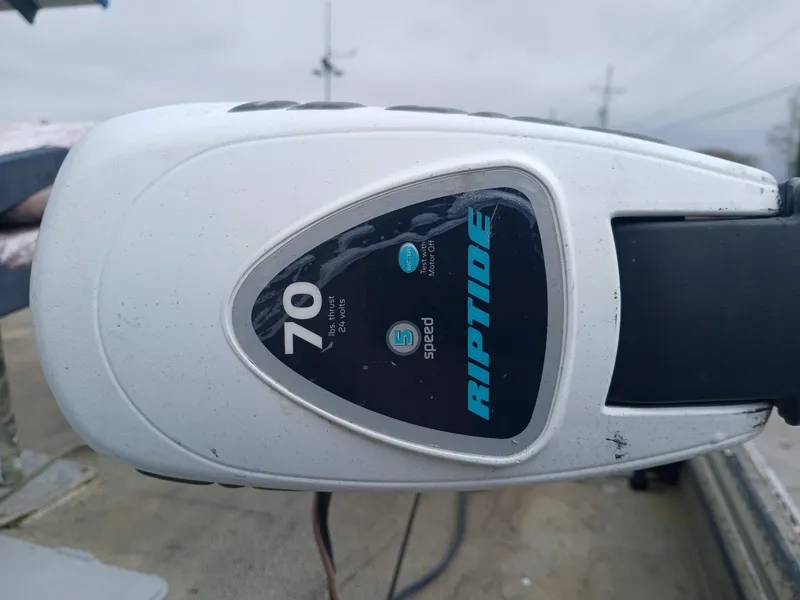 Slide: The Image of Riptide 70 trolling motor on 2004 Xpress 18 boat, five-speed control. - 5