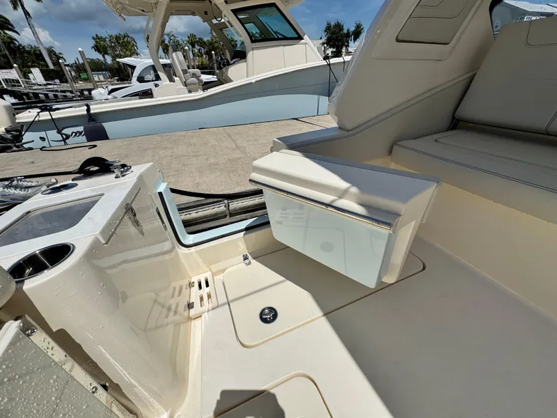 Slide: The Image of 2025 Scout 277 Dorado boat interior with seating and storage features. - 11